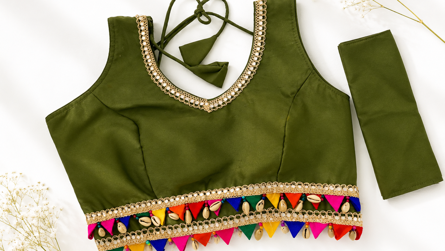 Green blouse with colorful fringe on a white background